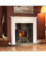 A black wood burning stove and multi fuel stove, limestone fireplace surround, slate fireplace chamber, tiled fireplace hearth