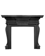 A black cast iron fireplace surround with a curved shaped frame and plant indentations