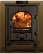 A black multi fuel stove, a compact stove fitted in a small fireplace opening, smart ecodesign stove