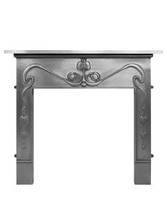 A fully polished cast iron fireplace surround with a linear design in art nouveau style and a pomegranate centrepiece