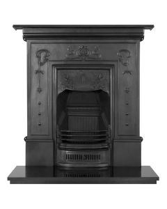 A black cast iron fireplace with decorative art nouveau motifs, along with a granite hearth and fire grate