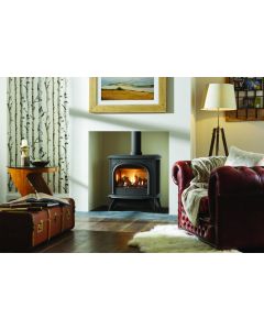 A Matt Black, gothic style, traditional gas stove with log fuel bed. A gas stove that looks like a log burner.