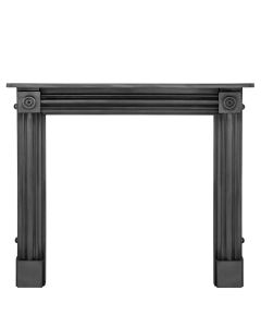 A black cast iron fireplace surround with a simple shaped frame and bullseye pattern indentations