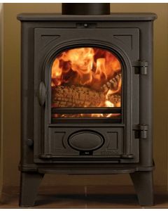 A black multi fuel stove, a compact stove fitted in a small fireplace opening, smart ecodesign stove