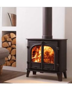 A black multi fuel stove, a wide front and narrow depth stove with double doors, ecodesign stove