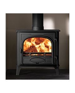 A black multi fuel stove, a wide front and narrow depth stove with single doors, ecodesign stove