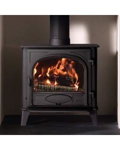 A black multi fuel stove, a large stove with large burn chamber, single doors, ecodesign stove