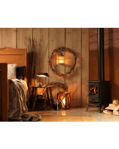 A black wood burning stove and multi fuel stove, a rustic stove, compact stove ideal leisure use