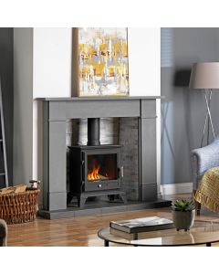 A black gas stove, a lpg gas stove, with a limestone fireplace surround, a grey fireplace chamber and a slate tiled hearth