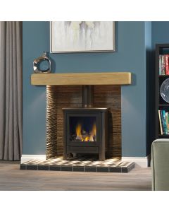 A black gas stove, a lpg gas stove, with an oak geocast beam, a olive slate fireplace chamber and a Harlequin tiled hearth
