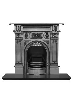 A large fully polished cast iron fireplace with decorative Victorian motifs, with a granite hearth and fire grate