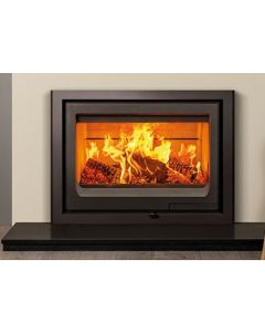 A black insert wood burning stove, classic landscape log burner set into the wall for a modern contemporary log burner style